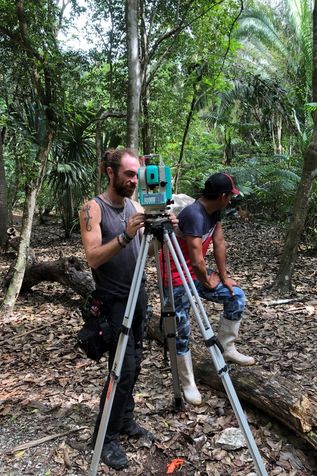 Anthropology student Jonathan Fournier-Crosato and Carlos install mapping equipment.