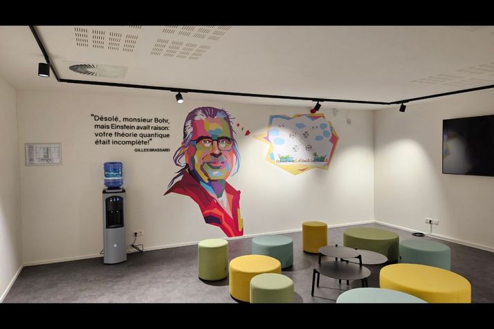 A two-and-a-half-metre-high, pop-art portrait of Gilles Brassard covers a wall of new laboratory named after Brassard at the Euro Space Centre in Transinne, Belgium. Beside it, in quotes, Brassard addresses the late Niels Bohr, the Nobel-Prize winning Dan