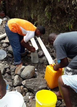 Photo taken in September 2017, after Hurricane Maria: people need to find a source of drinking water, as water supply systems have been destroyed.