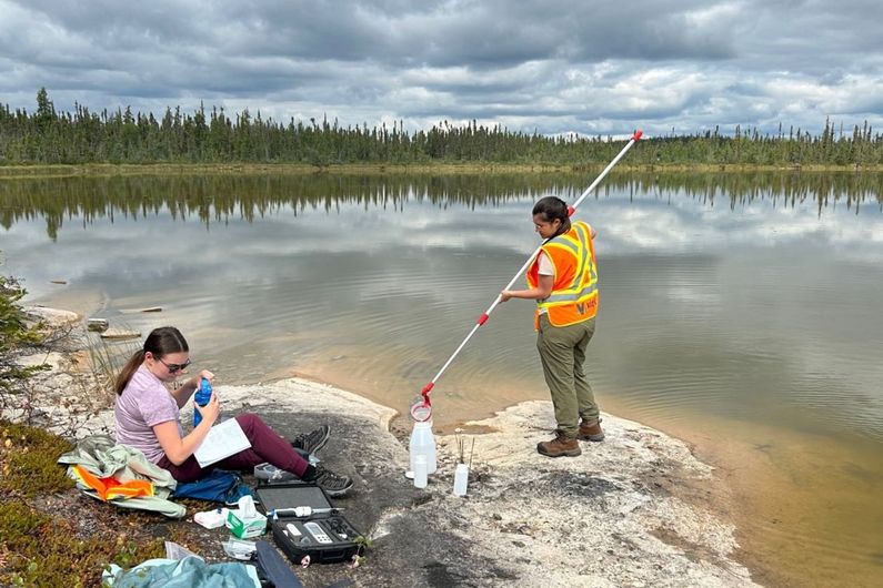 Students Laurianne Pagé and Marie-Hélène Brunet sampling near the Nechalacho mine, near Yellowknife.