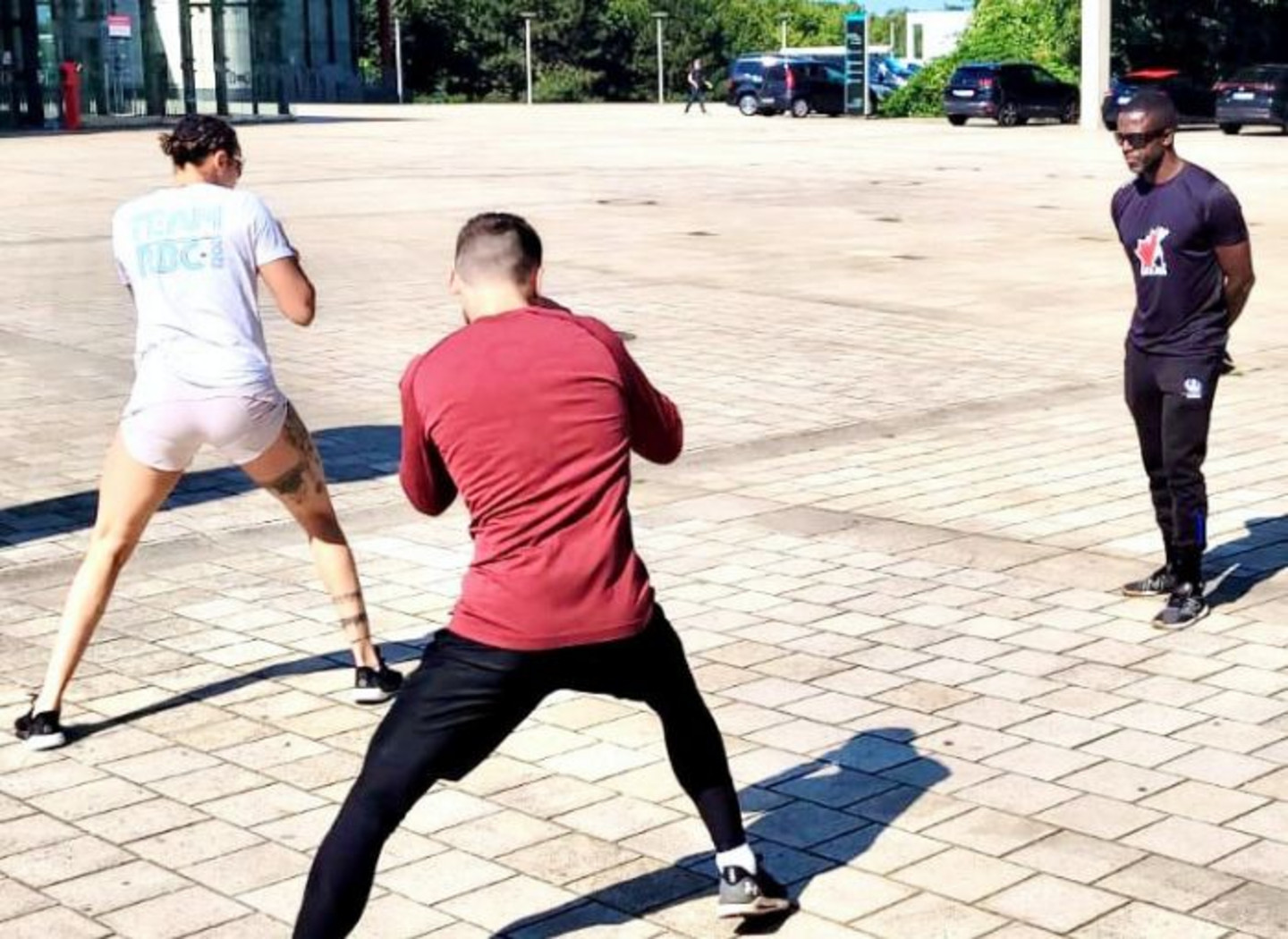Le préparateur physique Pierre-Mary Toussaint en entraînement avec Tammara Thibeault et Wyatt Sanford